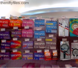 Magnifying Glasses Next To Condom Rack